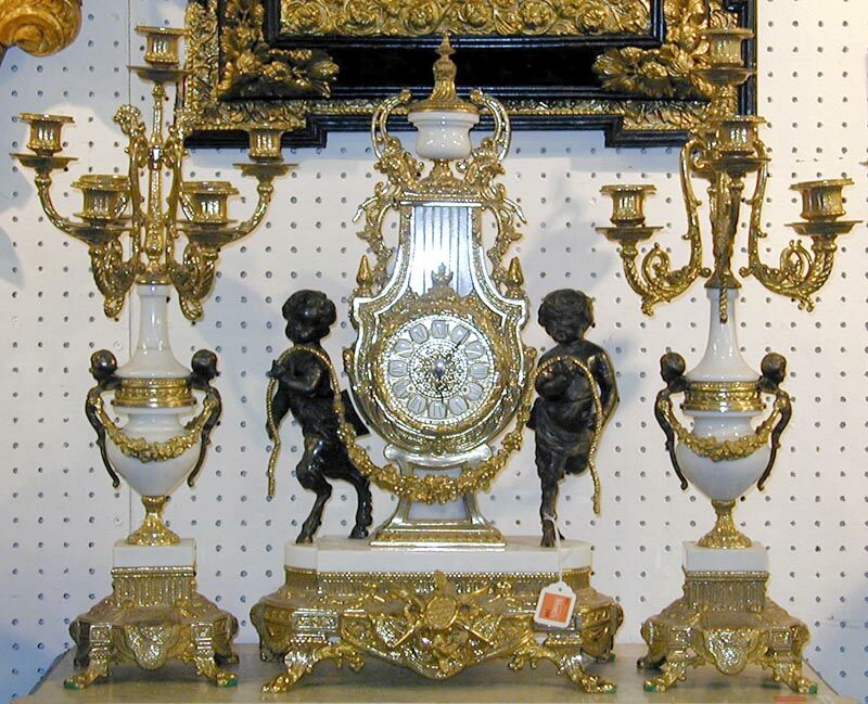 A PARCEL-GILT BRONZE MOUNTED PORCELAIN CLOCK GARNITURE. — Antique Clocks Price Guide