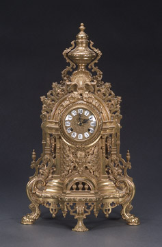 AN ELABORATE GILT BRONZE MANTEL CLOCK, 20th century, dial molded 'Imperial', movement with German maker's mark. — Antique Clocks Price Guide