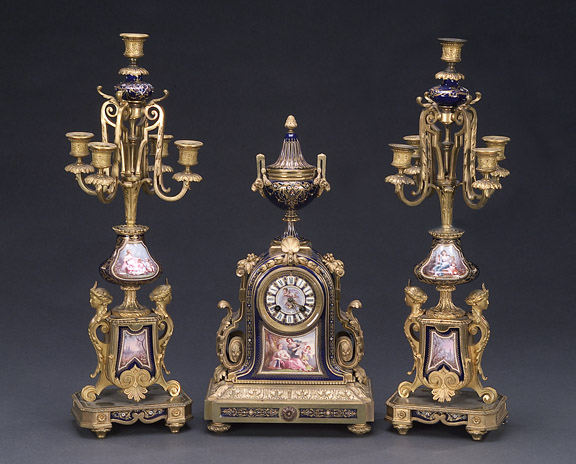 A GILT BRONZE MOUNTED 'JEWELED' 'SEVRES' COBALT-BLUE GROUND PORCELAIN CLOCK GARNITURE, late 19th/early 20th century. — Antique Clocks Price Guide