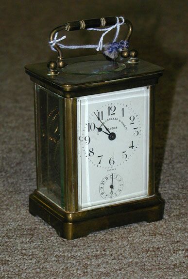 A FRENCH BRASS AND GLASS CARRIAGE CLOCK, the works stamped Duverdrey & Bloquel, retailed by Memod, Jacquard & King, St. Louis. — Antique Clocks Price Guide