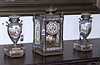 A LOUIS XVI STYLE GILT-BRONZE MOUNTED PORCELAIN, CHAMPLEVE AND 'JEWELED' THREE PIECE CLOCK GARNITURE, The works stamped Japy Freres.
