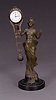 A CONTINENTAL PATINATED METAL FIGURAL FREE-SWINGER CLOCK, Late 19th/early 20th century, after a model by F(ranz) Iffland.