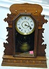 A "GERANIUM "OAK MANTEL CLOCK, William L. Gilbert Clock Co. Winstead, Connecticut, USA.