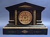 AN AMERICAN EBONIZED AND MARBLIZED CAST IRON MANTLE CLOCK, 19th century, mechanism stamped 'ANSONIA CLOCK/U.S.A./NEW YORK'.