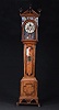 A DUTCH CLASSICAL INLAID AND PARCEL-GILT ELMWOOD AND PART-EBONISED LONGCASE CLOCK, early 19th century.