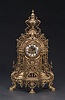 AN ELABORATE GILT BRONZE MANTEL CLOCK, 20th century, dial molded 'Imperial', movement with German maker's mark.