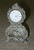 A DUTCH SILVER MINIATURE BRACKET CLOCK, late 19th century.