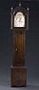 AN AMERICAN STAINED PINE TALL CASE CLOCK BY R. WHITING, WINCHESTER, early 19th century.