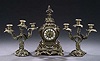 A LOUIS XV STYLE BRONZE THREE-PIECE MANTEL GARNITURE, late 19th century, movement impressed EB, dial inscribed Emile Vie & Cie/Paris.