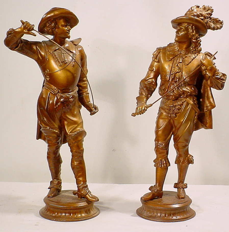 Two Ansonia metal figural statues, — Antique Clocks Price Guide