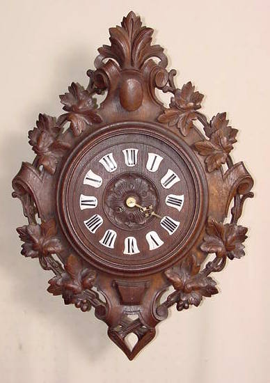 Heavily carved oak hanging wall clock — Antique Clocks Price Guide