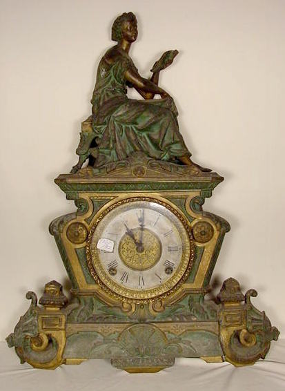 Gilbert metal statue clock — Antique Clocks Price Guide