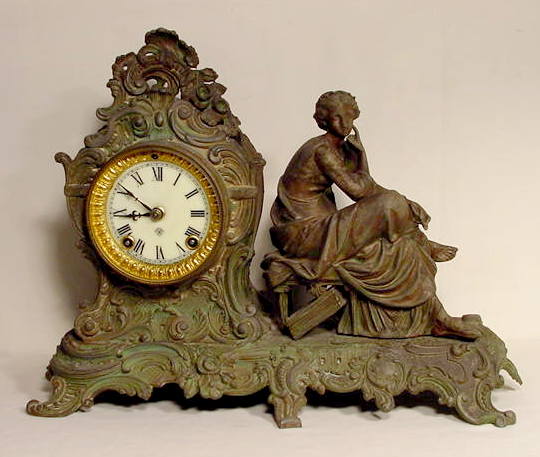 Gilbert metal statue clock — Antique Clocks Price Guide