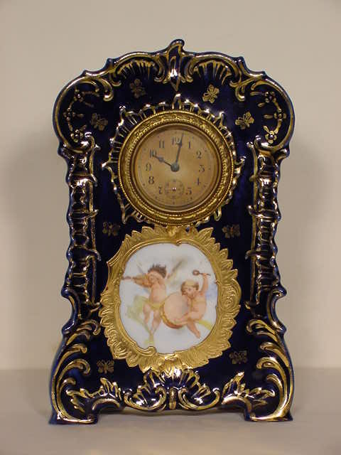Musical children on gilded — Antique Clocks Price Guide