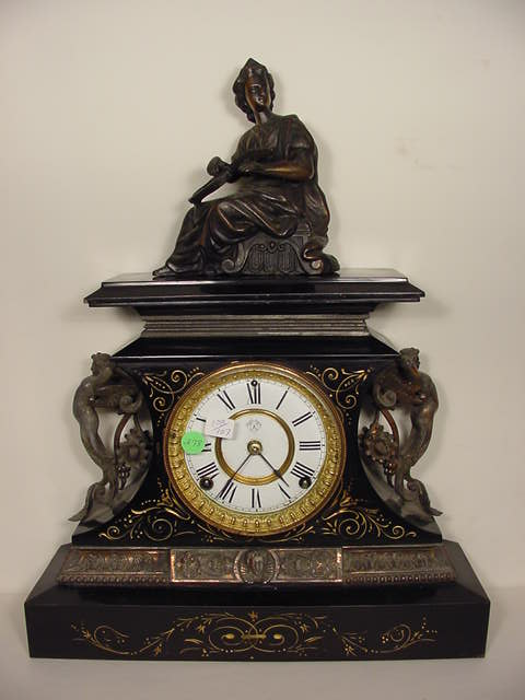 Ansonia black metal statue clock, — Antique Clocks Price Guide