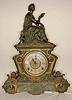 Gilbert metal statue clock