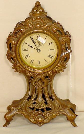 Bronze plated spelter alarm clock: — Antique Clocks Price Guide