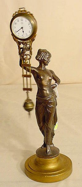 Junghans figural swinger clock: — Antique Clocks Price Guide