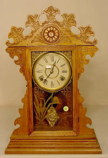Welch oak & mixed wood parlor clock. — Antique Clocks Price Guide