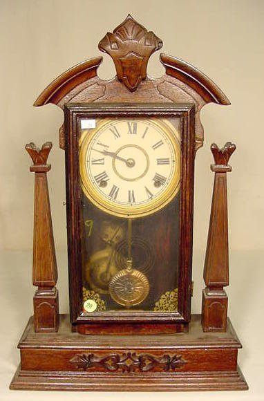 Walnut & mixed wood parlor clock. — Antique Clocks Price Guide