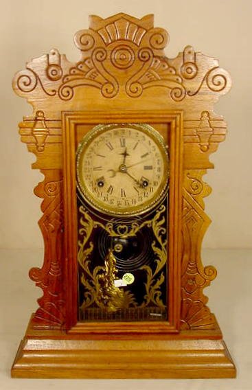Waterbury walnut shelf clock with calendar: — Antique Clocks Price Guide