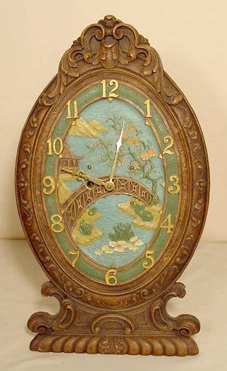 Wood easel back desk clock: painted Oriental scene; time only. — Antique Clocks Price Guide