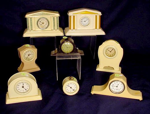 Collection of 8 celluloid case clocks: — Antique Clocks Price Guide