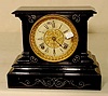 Ansonia iron case table clock.