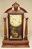 Walnut & mixed wood parlor clock.