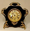 Ansonia iron case mantle clock.