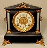 Ingraham black mantle clock.