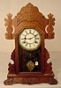 Waterbury walnut shelf clock. 