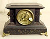 Black mantle clock: maker not identified; 