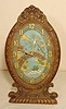 Wood easel back desk clock: painted Oriental scene; time only. 