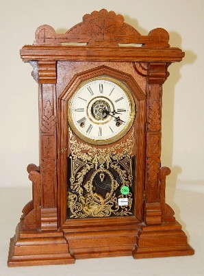 E. Ingraham Carved Walnut Parlor Clock w/Alarm — Antique Clocks Price Guide