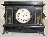 Sessions Black Mantle Clock w/Ladies and Lion Head
