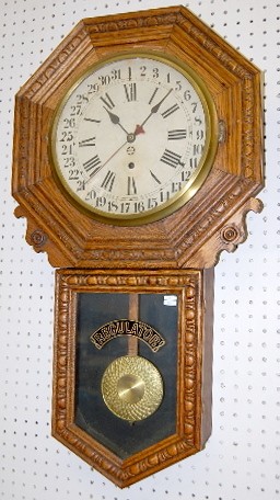 New Haven Carved Oak Calendar Schoolhouse Clock — Antique Clocks Price Guide