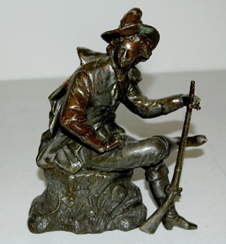 Hunter Seated On A Stump Metal Clock Statue — Antique Clocks Price Guide