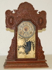 E. Ingraham Oak Kitchen Clock w/ Lions — Antique Clocks Price Guide