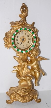 Metal Figural Cherub Novelty Clock — Antique Clocks Price Guide