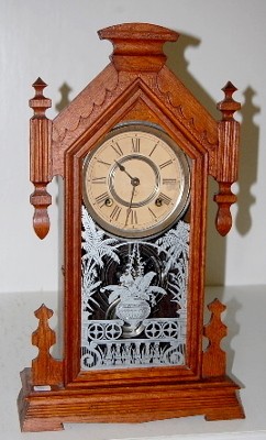 Ansonia "Africa" Oak Kitchen Clock: T and S — Antique Clocks Price Guide