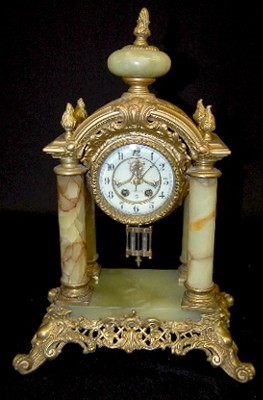 Gilbert Onyx and Ornate Metal 4 Column Clock — Antique Clocks Price Guide