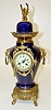 French Porcelain Urn Clock W/ Griffins