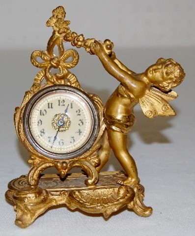 Metal Novelty Cherub Figural Dresser Clock — Antique Clocks Price Guide