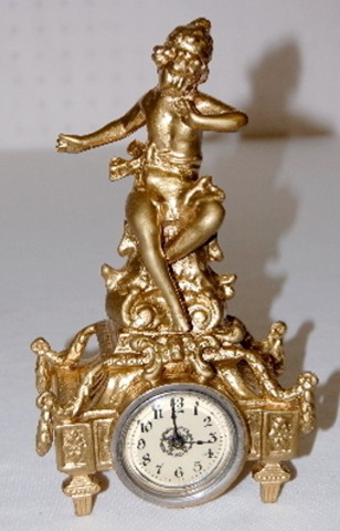 Metal Novelty Cherub Figural Dresser Clock — Antique Clocks Price Guide
