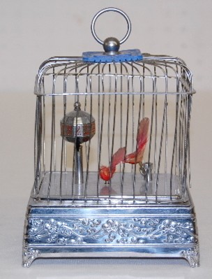 Animated Musical Bird and Cage Alarm Clock — Antique Clocks Price Guide