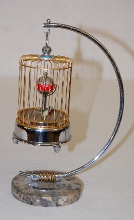 Occupied Japan Animated Bird in Cage Clock — Antique Clocks Price Guide