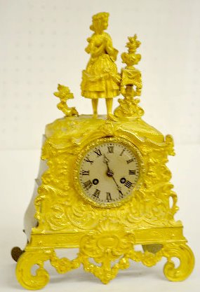 S Marti Gilt Bronze Silk String Clock, Woman — Antique Clocks Price Guide