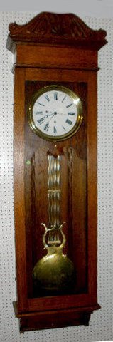 Oak Jewelers Pinwheel Regulator Clock — Antique Clocks Price Guide