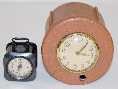 2 Clocks; German Alarm & Lux Cigarette Dispenser — Antique Clocks Price Guide
